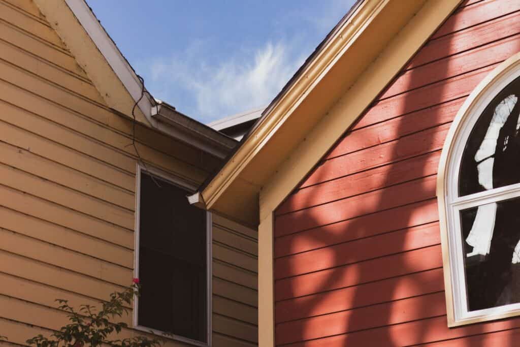 Houses with tan and red siding