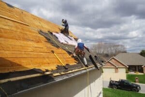 Roofers working on roof